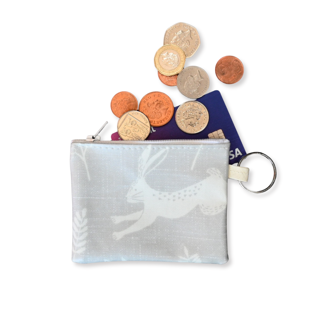 running hare purse with cards and coins spilling out