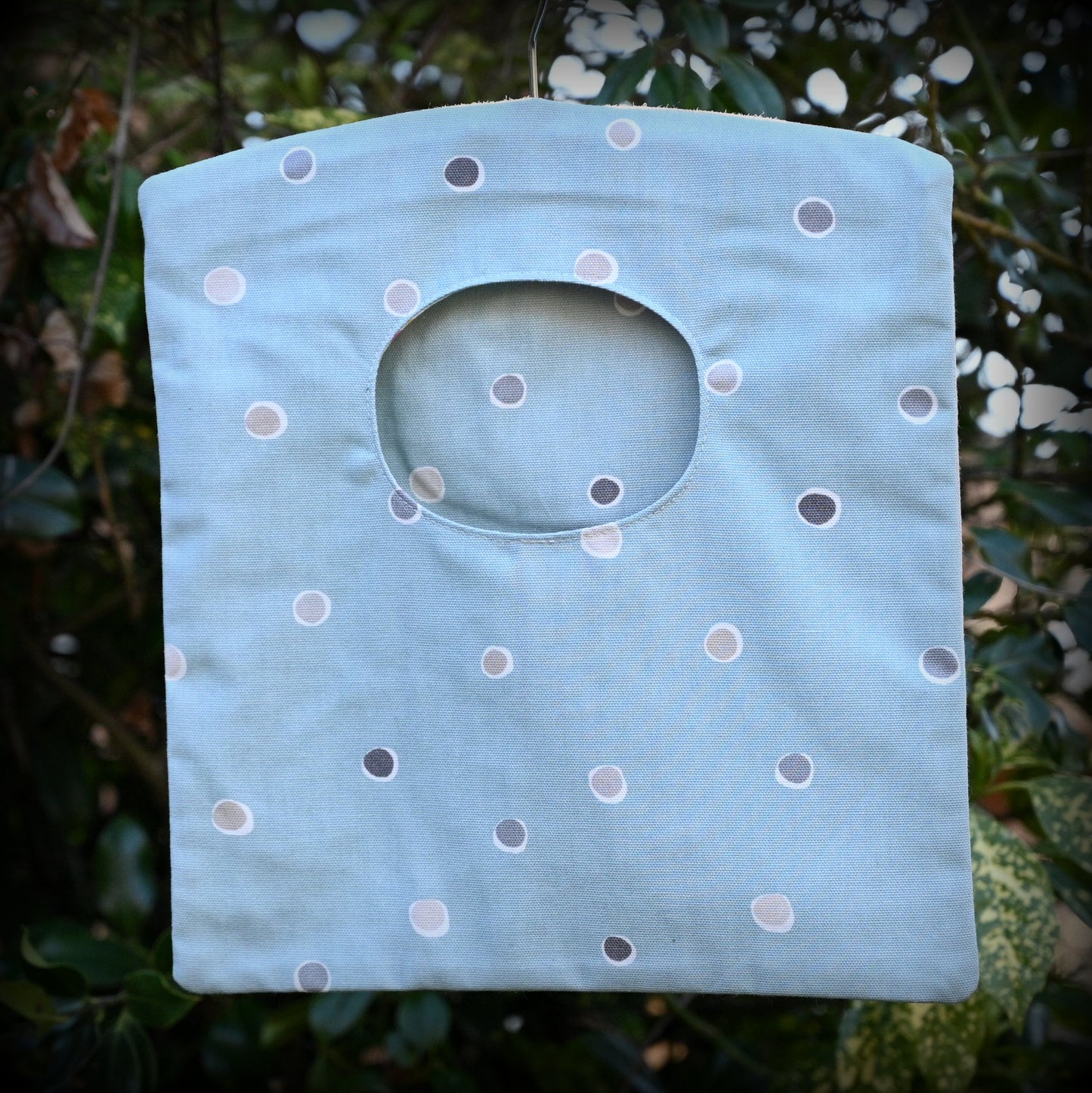 blue spotty peg bag hung outside