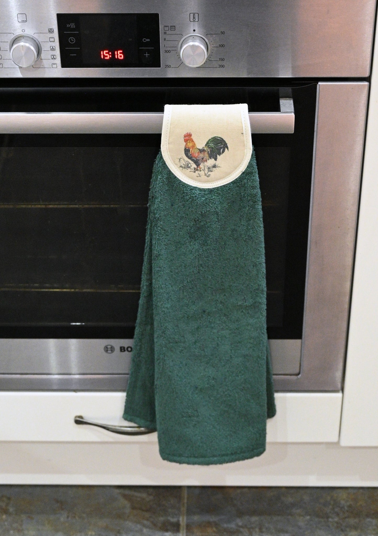 green cockerel hang ups on cooker rail