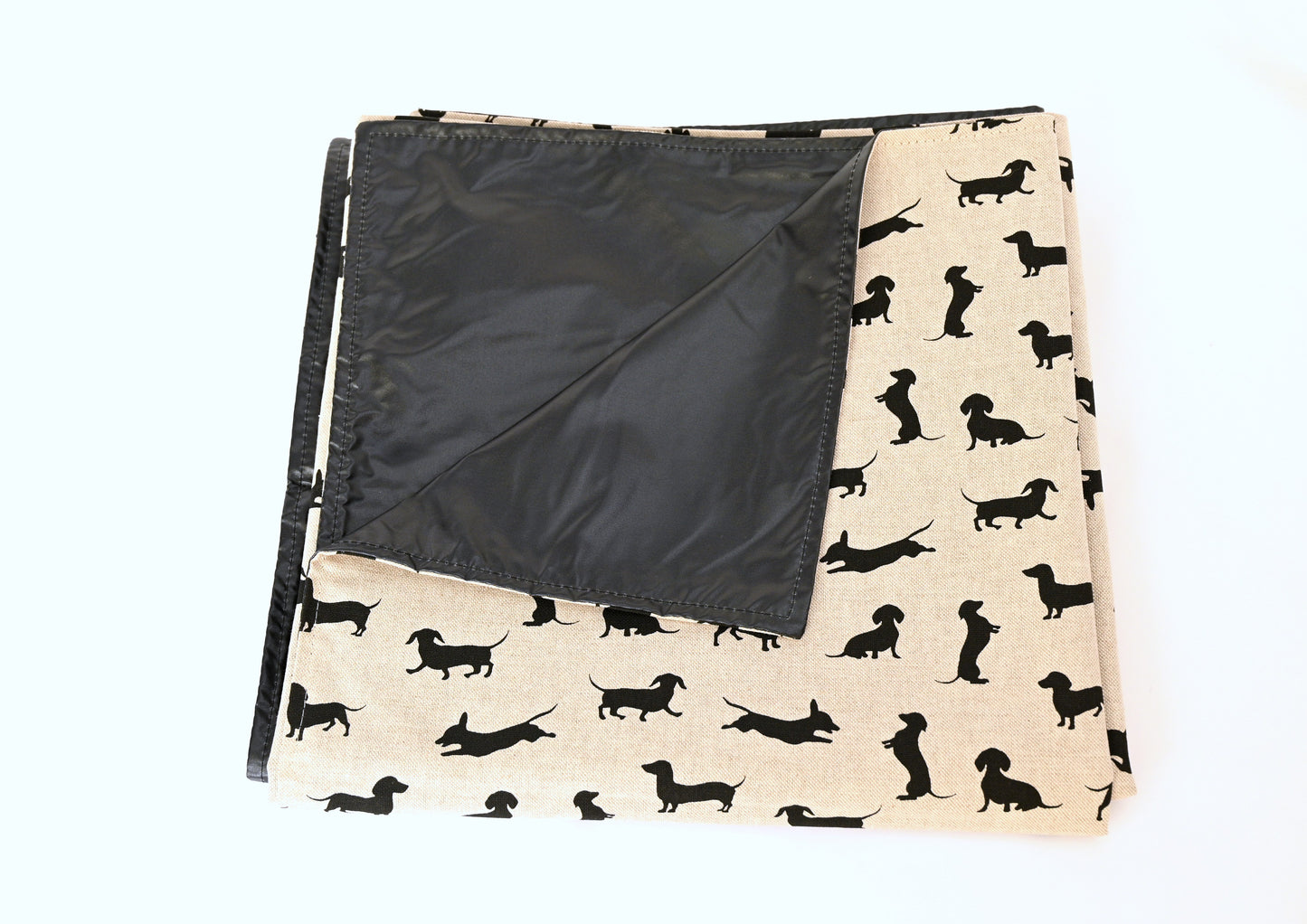 black dachshund picnic rug folded up