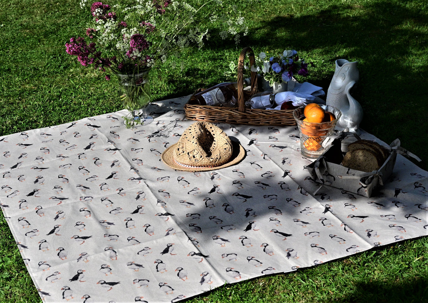 puffins picnic rug lifestyle in park