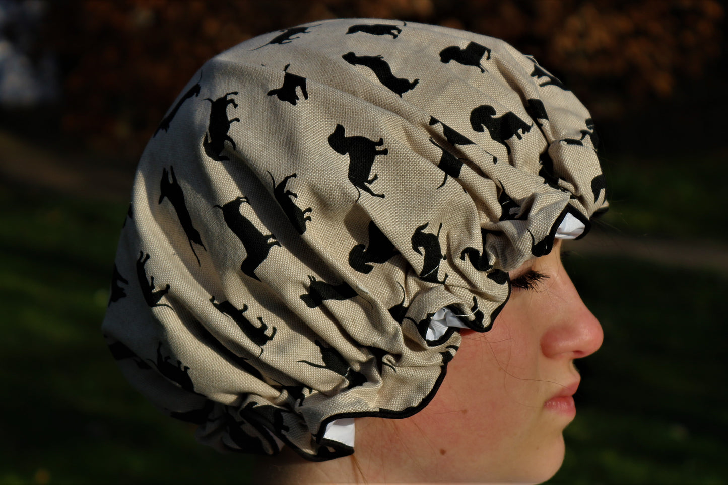 Shower hat shown on head outside in nature
