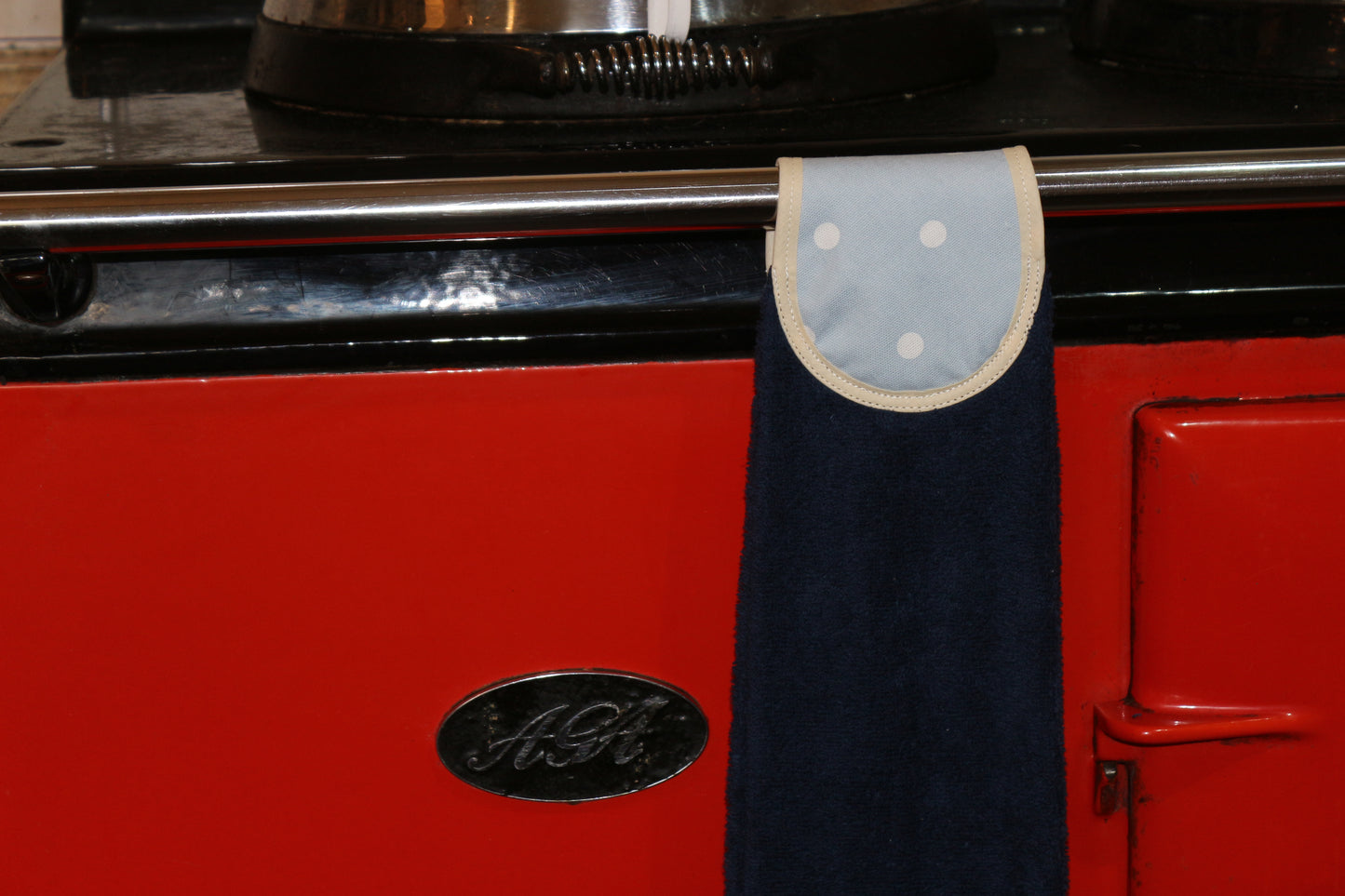 blue spots hang up towel on red aga rail