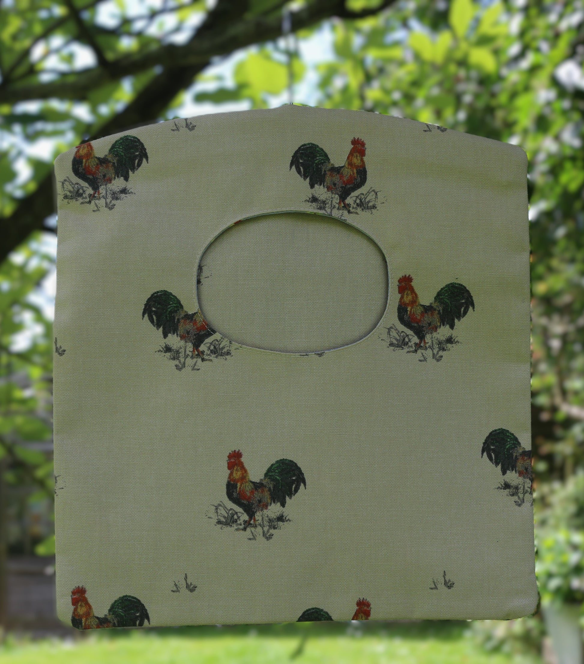 cockerel peg bag hung on tree outside