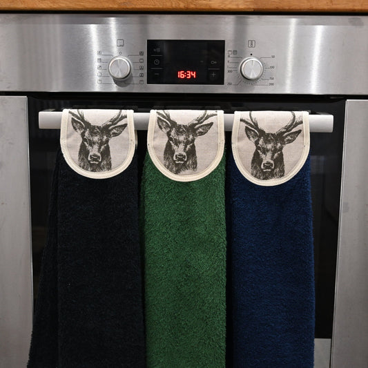 black, green and navy stag hang ups on oven