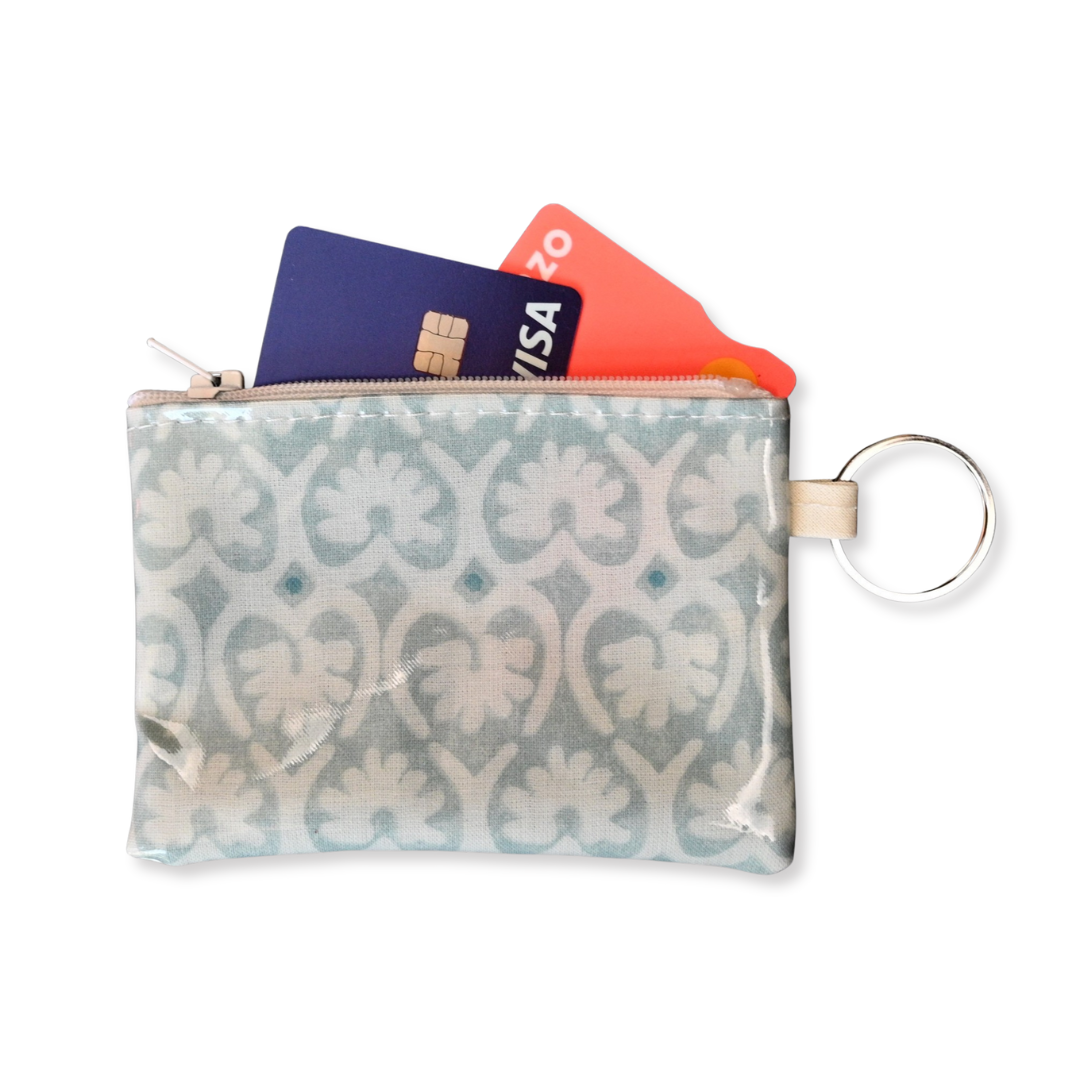 green lotus purse with cards spilling out