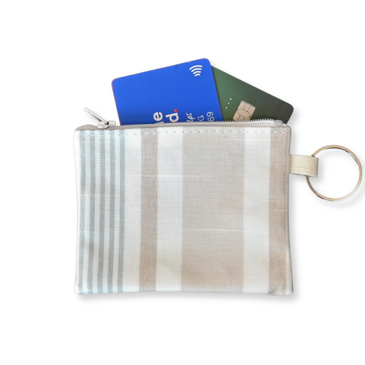 striped purse with cards spilling out