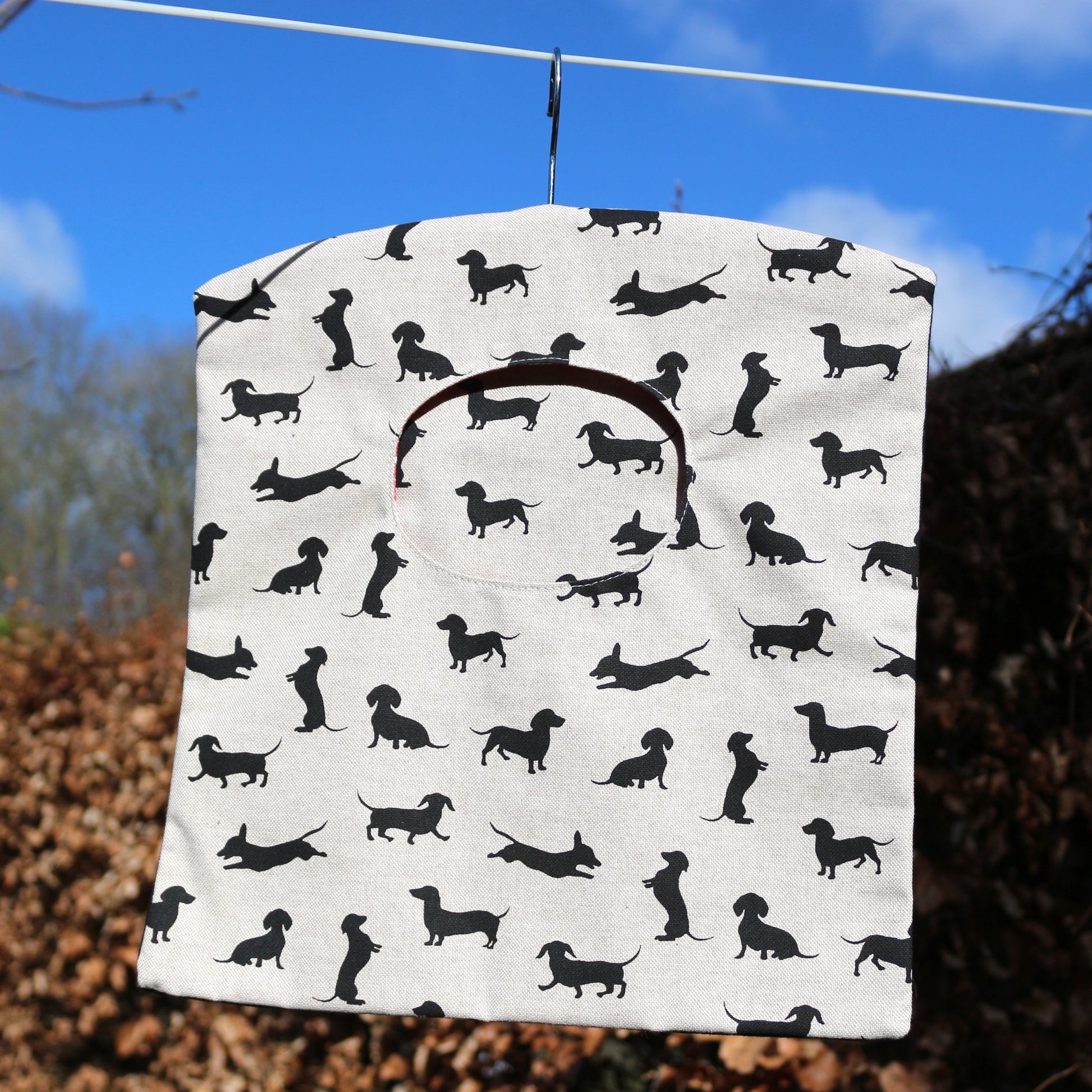 black dachshund peg bag on a washing line 