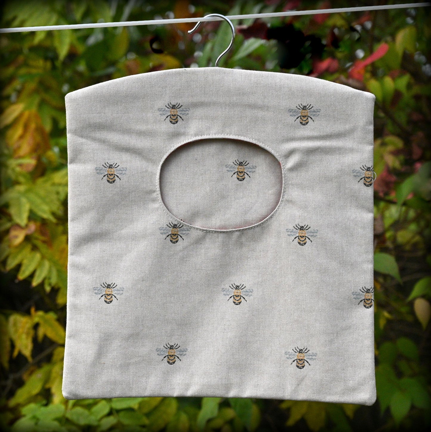 bees peg bag hanging on washing line