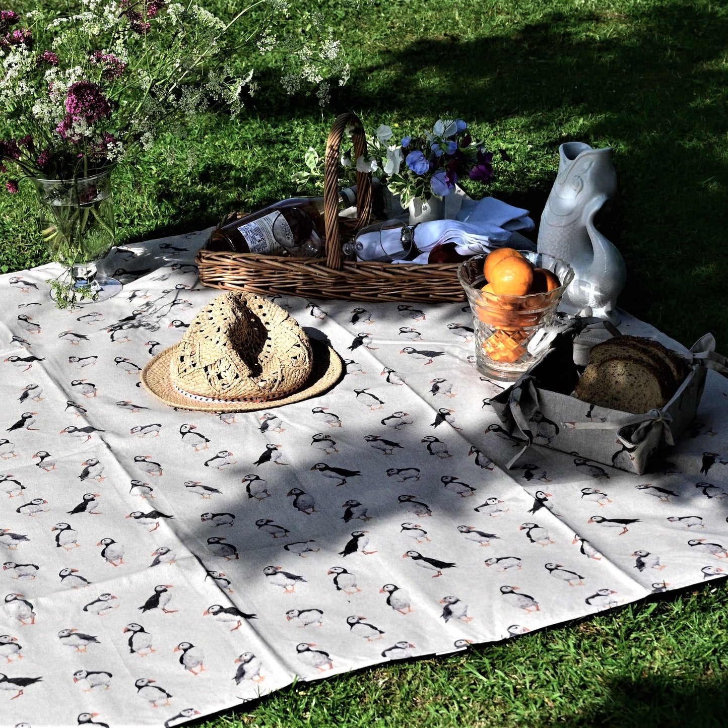 puffins picnic rug lifestyle in park