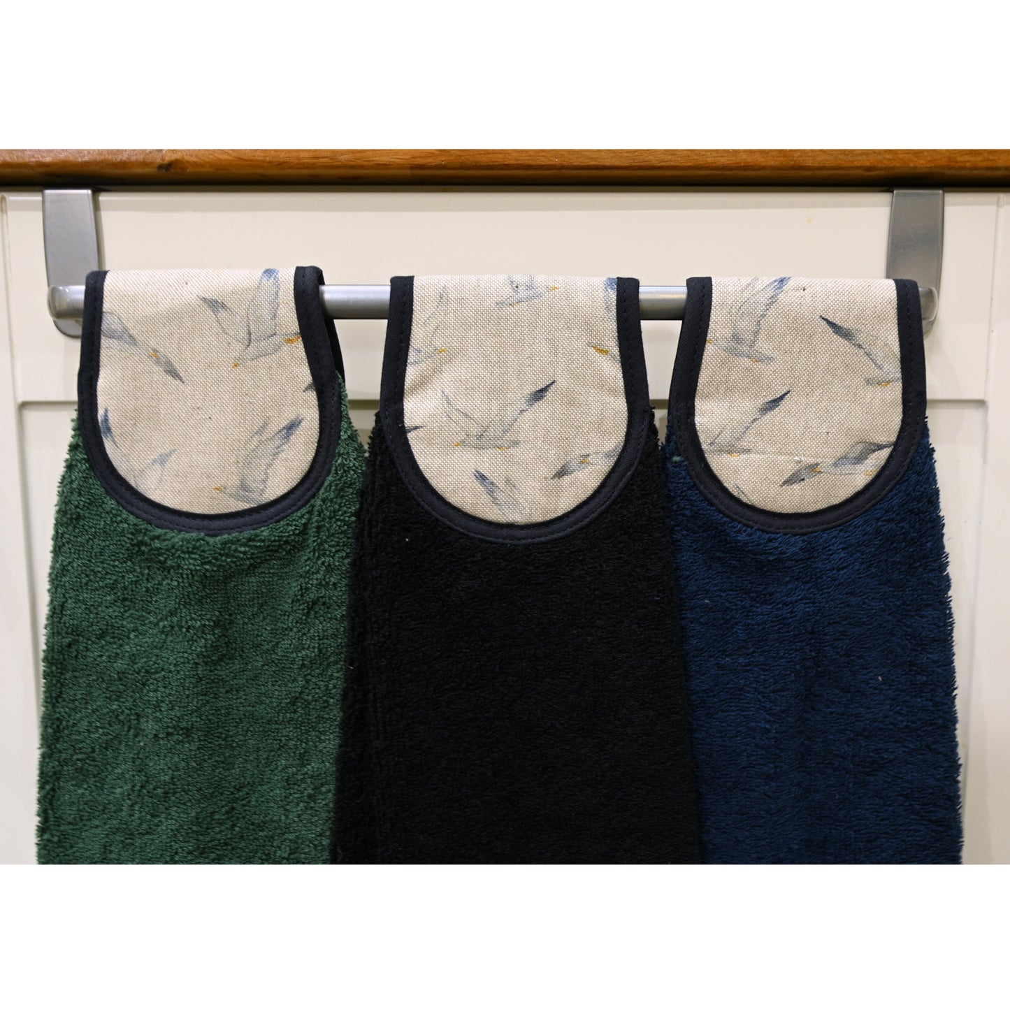 closer up of seagulls hang ups on rail