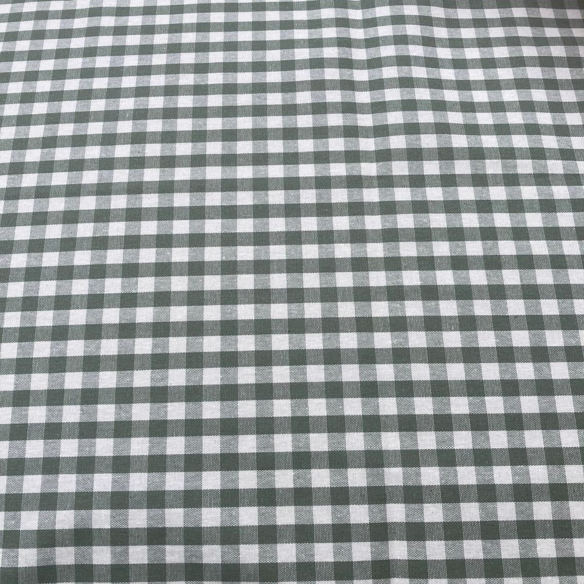 Close-up of green and white checkered gingham tablecloth