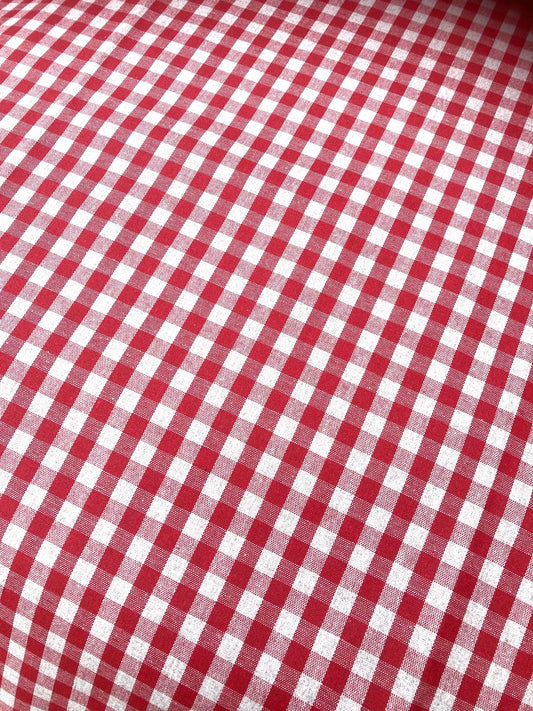Close-up of red and white checkered gingham tablecloth