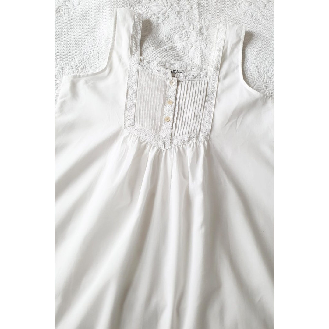 nicole dress lay out on white sheet