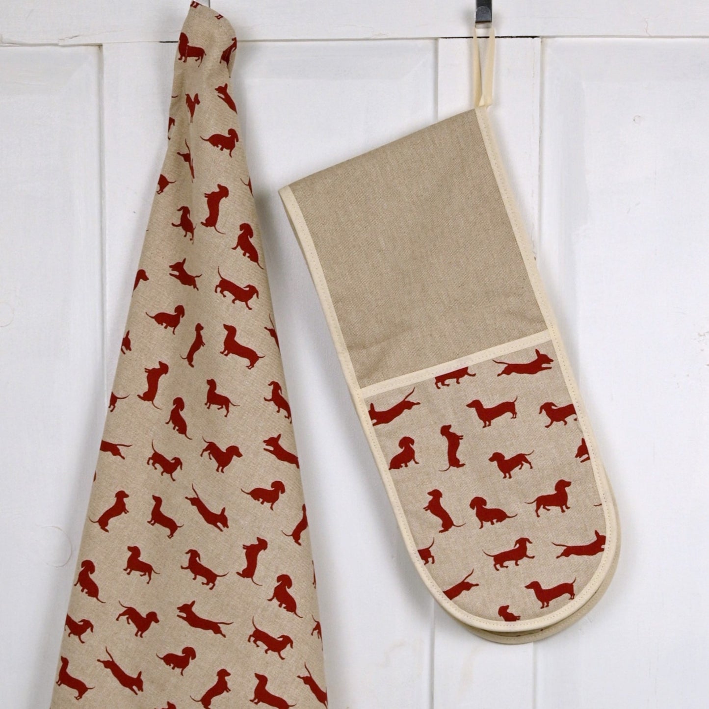 lifestyle hung up red dachshund oven gloves and tea towel