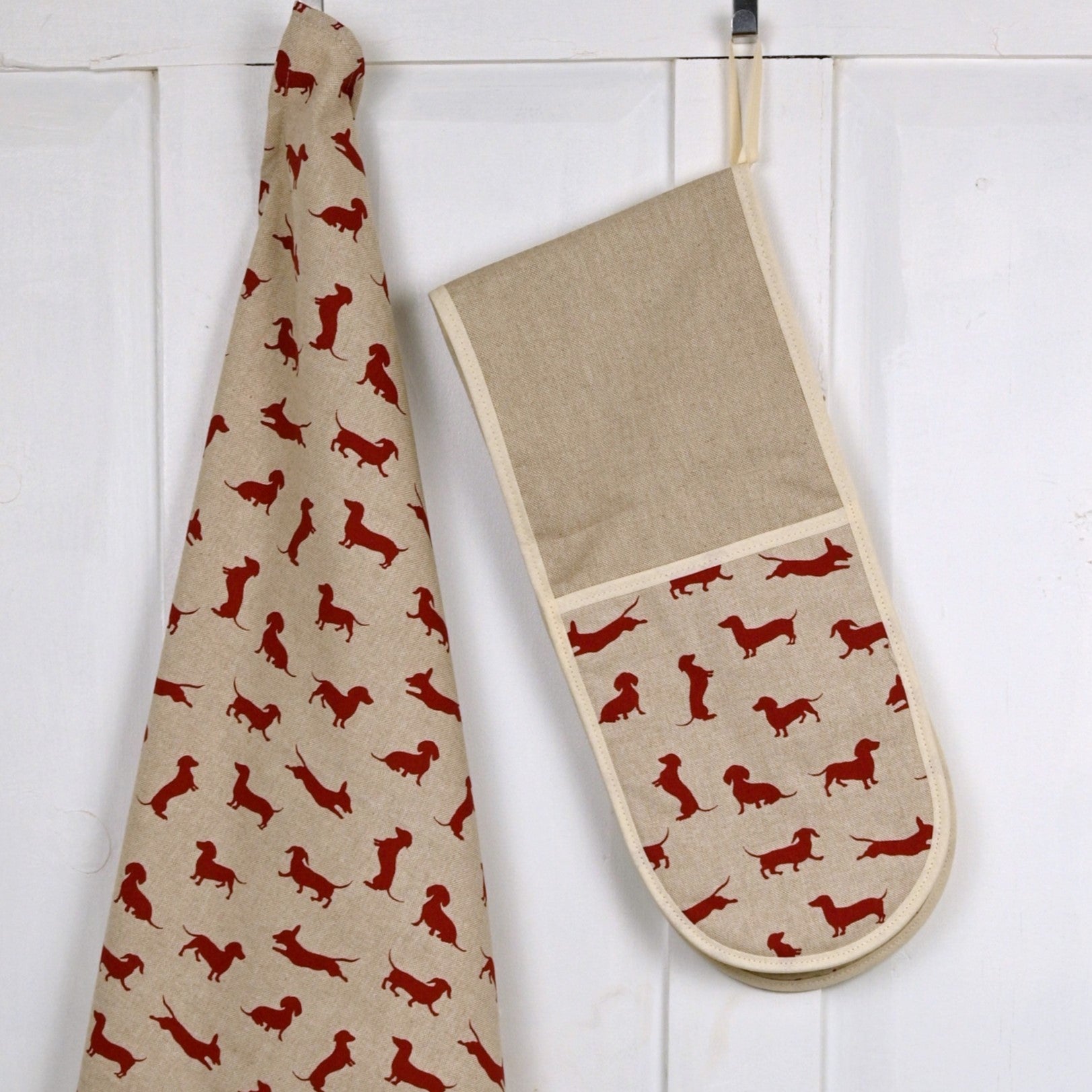 lifestyle hung up red dachshund oven gloves and tea towel