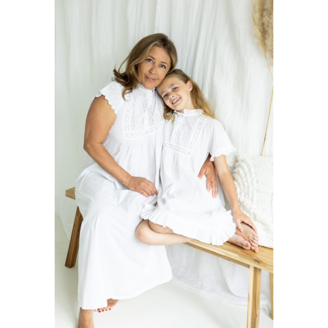mother and daughter both pictured in polo short sleeve nightdress sat down
