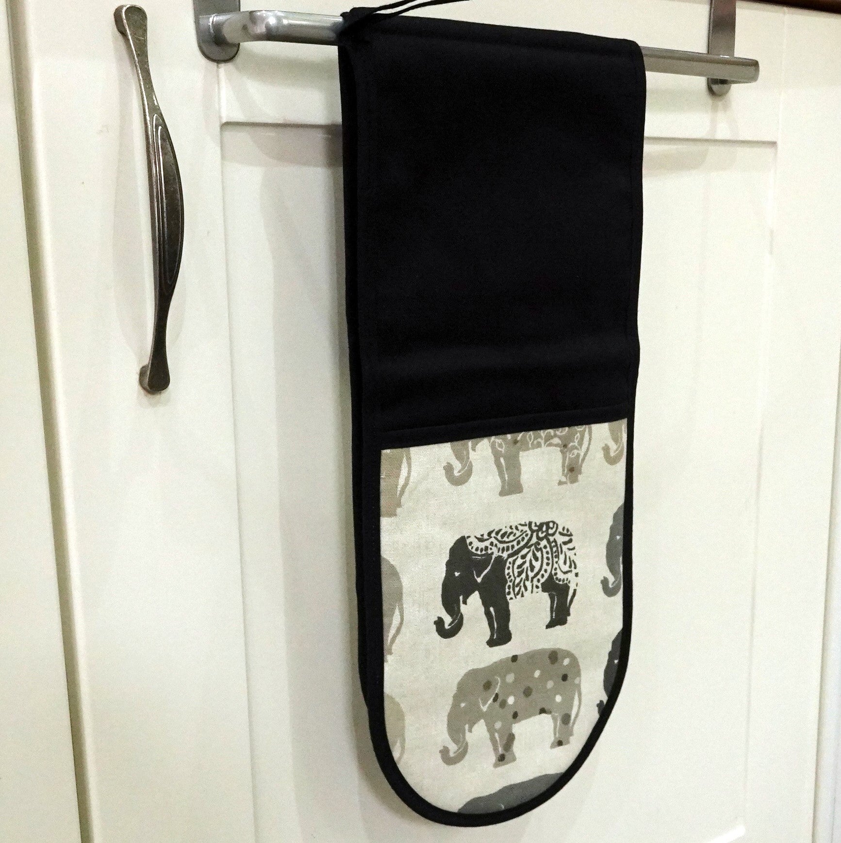 hung up grey elephant oven gloves
