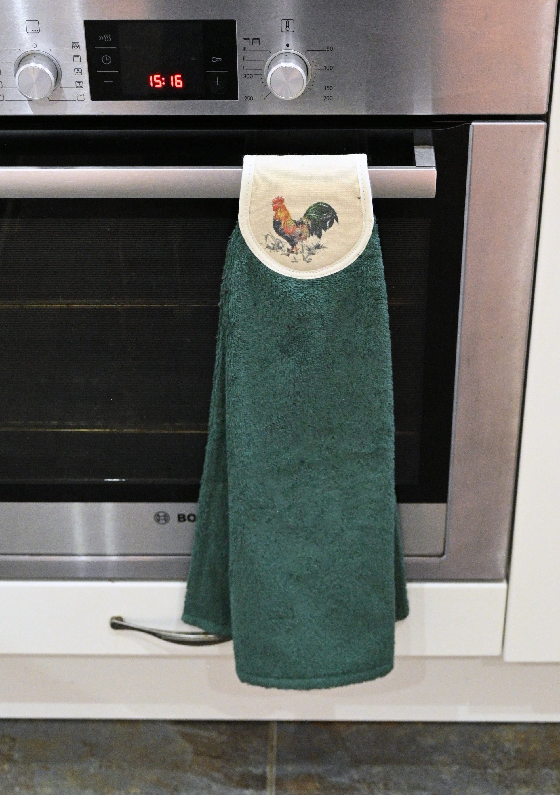 green cockerel hang ups on cooker rail