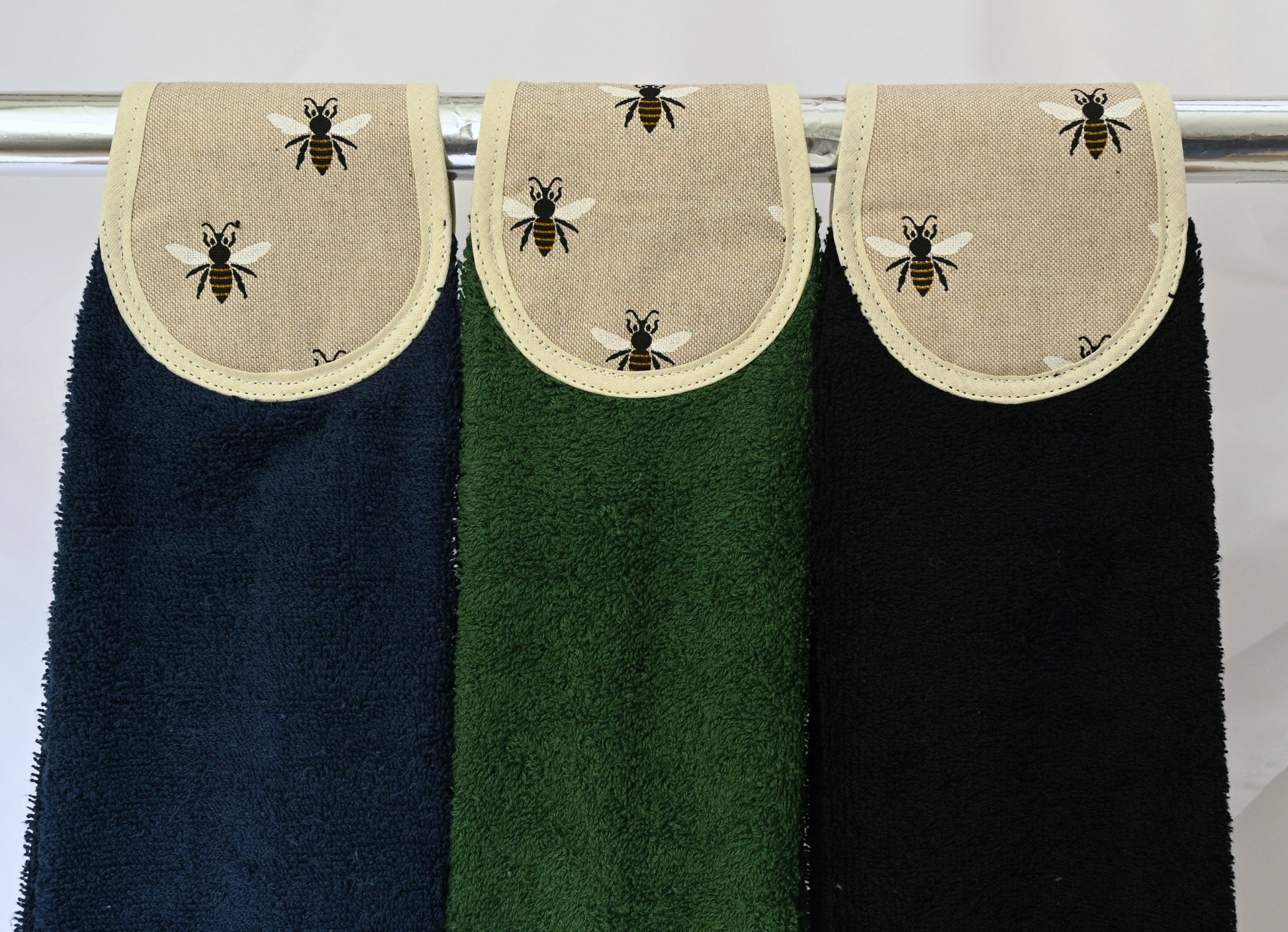 navy, green and black old bees design hang ups on rail