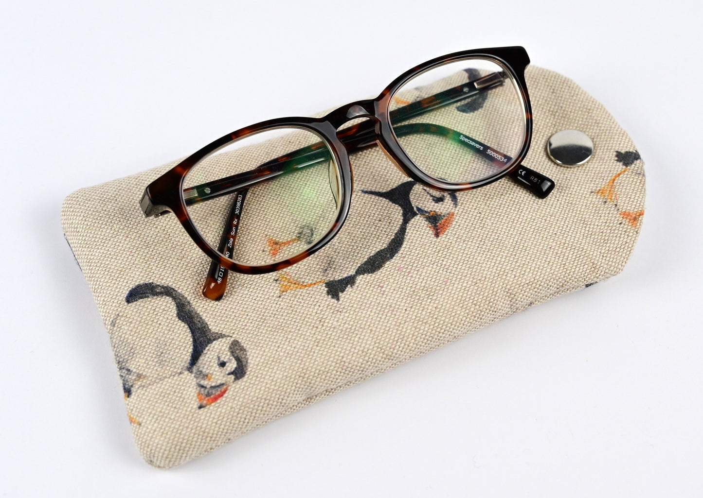 puffins glasses case with pair of reading glasses on top