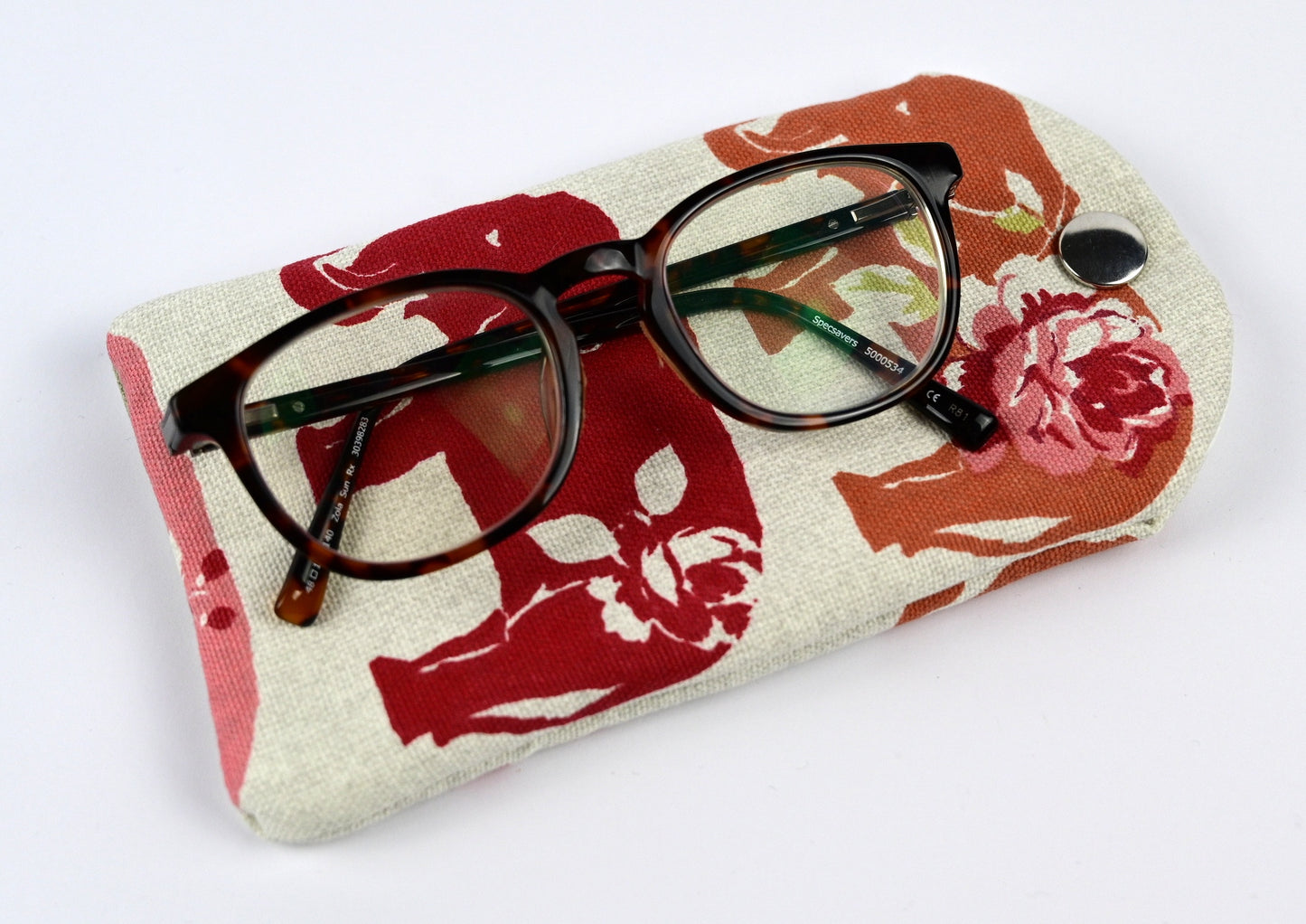 spice elephant glasses case with pair of reading glasses on top