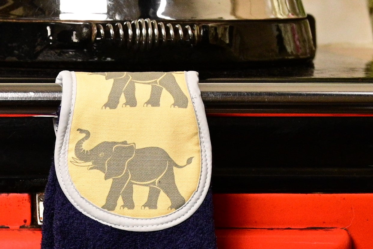 navy towel yellow elephants hang ups on rail of aga