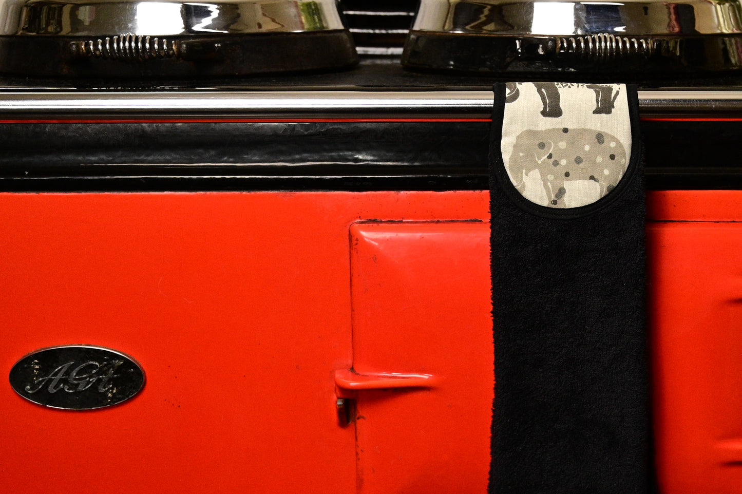 grey elephants hang up towel on red aga
