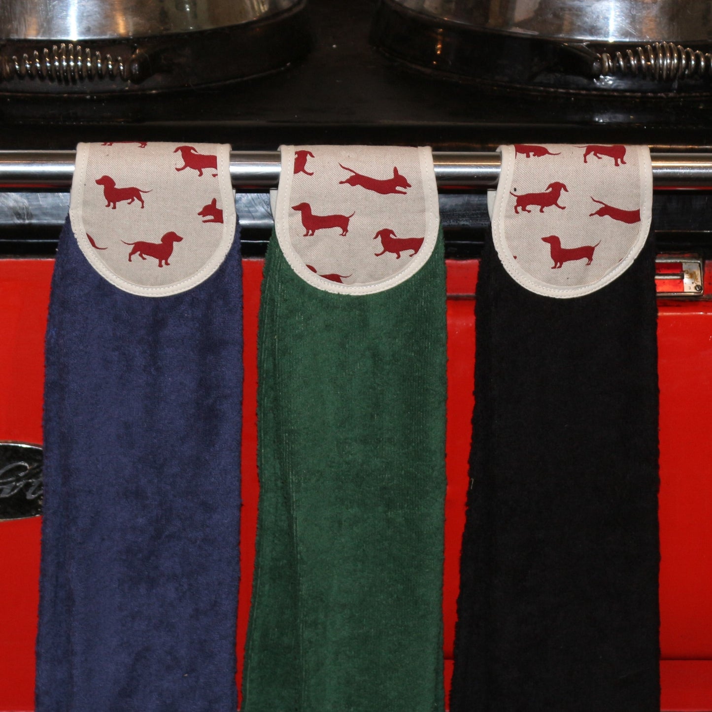 navy, green and black hang ups in red dachshund design on red aga