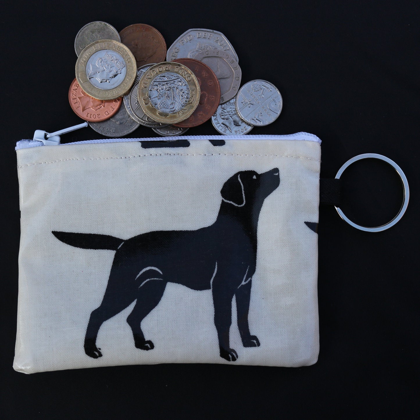 black labrador purse with coins spilling out