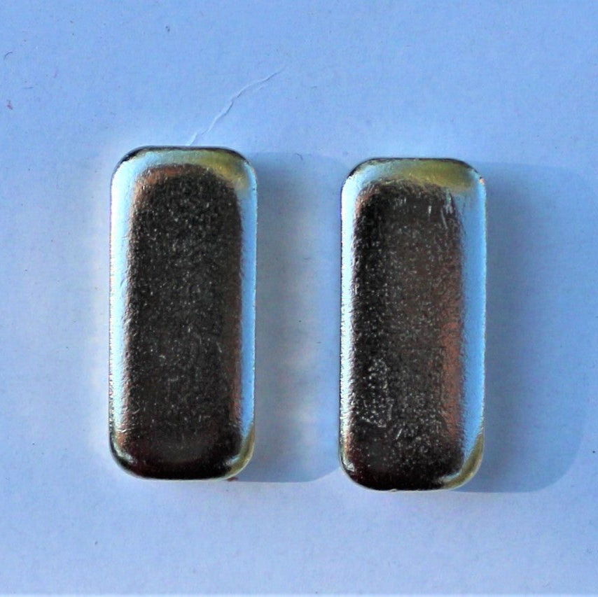 pair of magnets on blue background