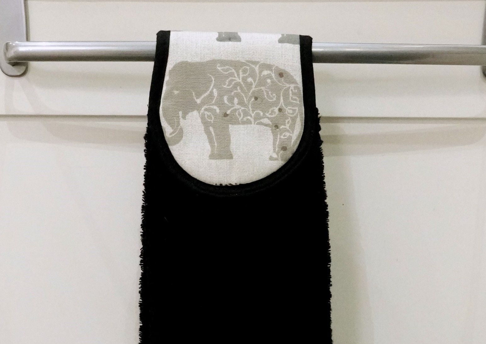 close up of grey elephants hang up towel
