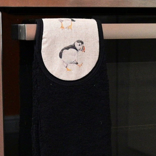 puffins hang up towel on cooker rail